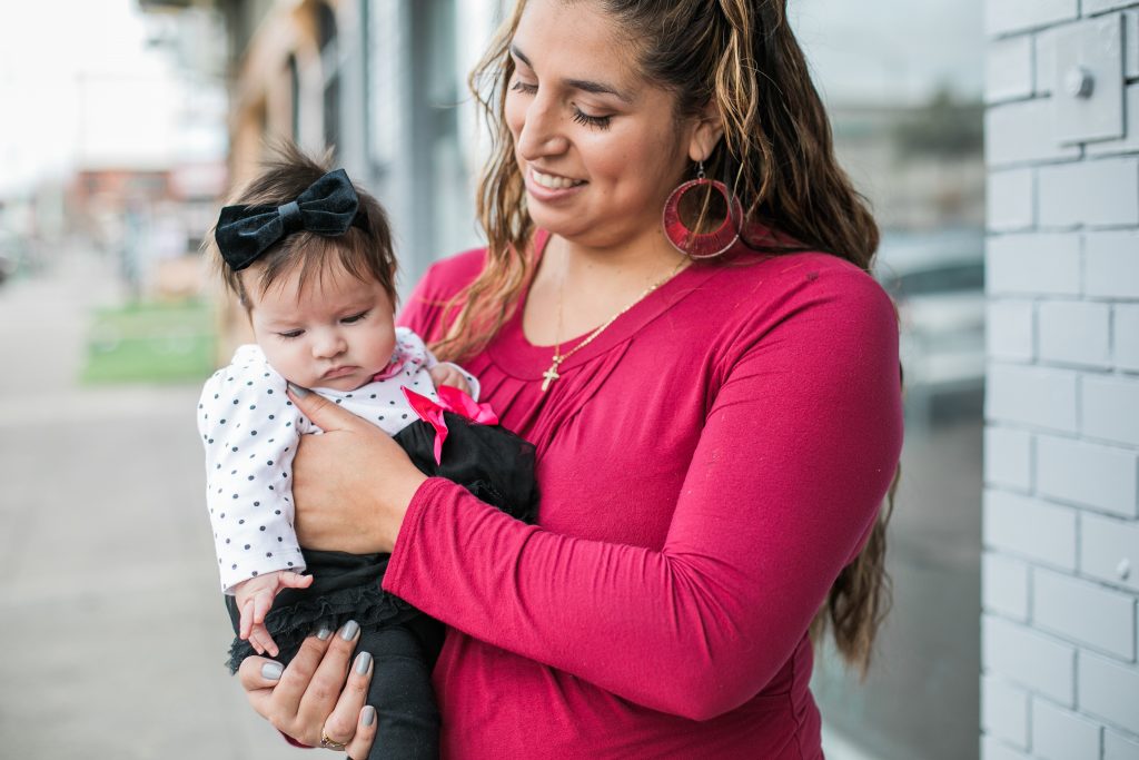 Mom holding baby outside