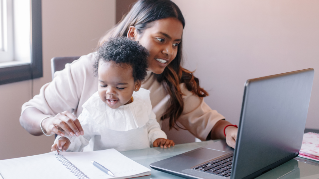 Image of mother and baby at computer