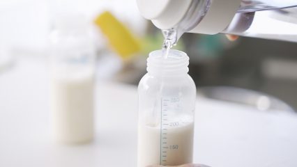 Featured Image of person making baby formula