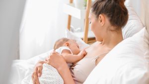 Mother breastfeeding her newborn baby