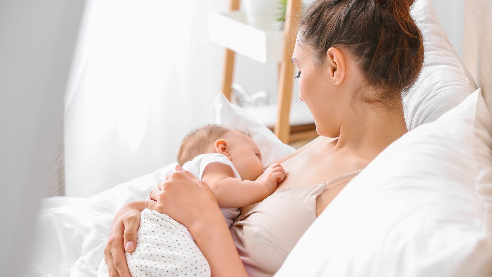 Breastfeeding Mother breastfeeding her newborn baby