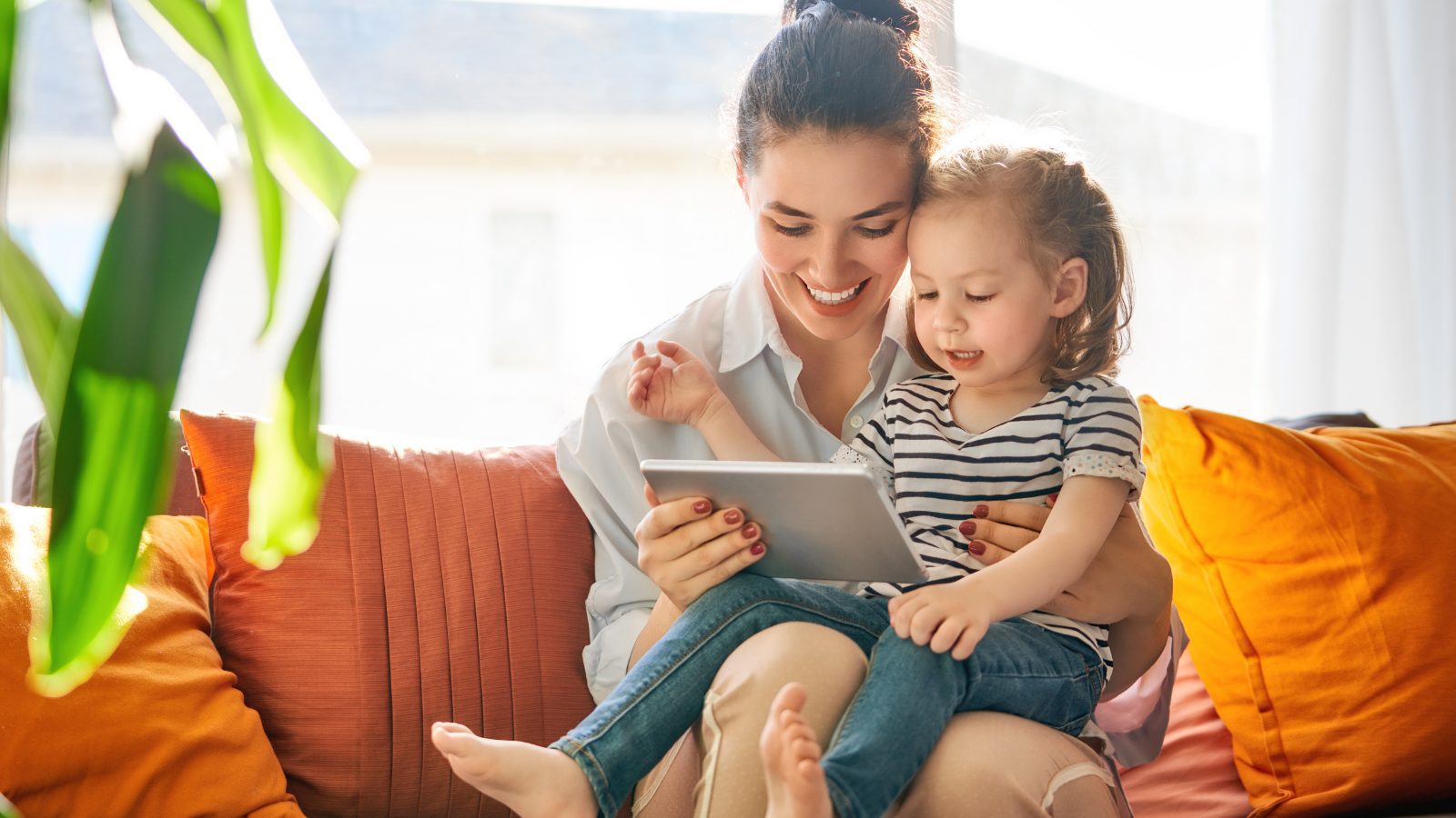 Mom and child looking at tablet
